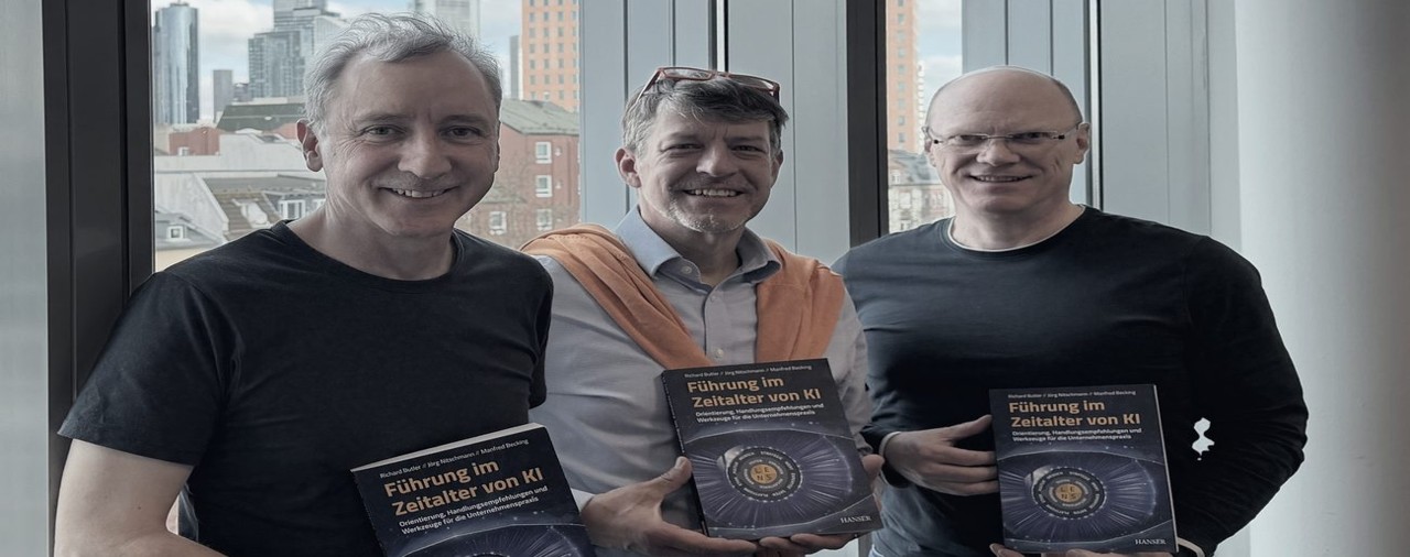 The three founders with their book, Leading in the Age of AI